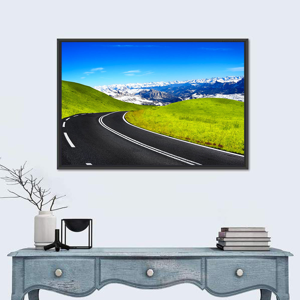 Winding Road Through Snow-capped Mountains Wall Art in a room, landscape