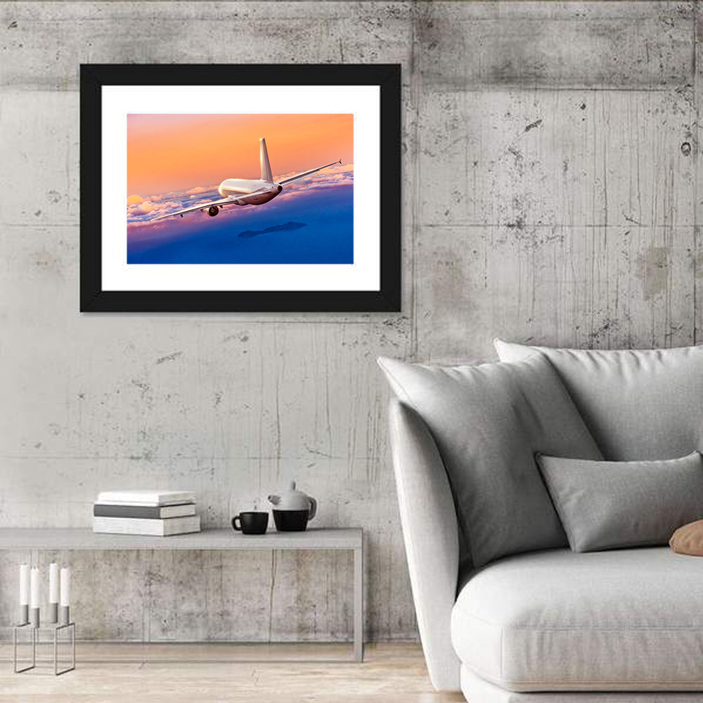 Airplane Over Clouds at Sunset Wall Art in a room, landscape
