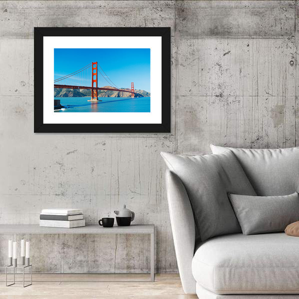 Golden Gate Bridge Under Blue Sky Wall Art in a room, landscape