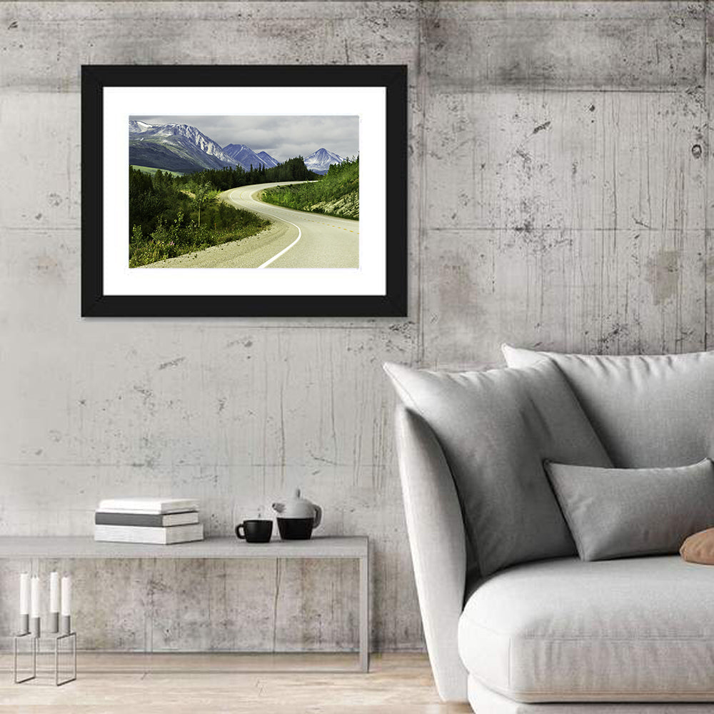 Winding Road to Snow Capped Alaskan Peaks Wall Art in a room, landscape
