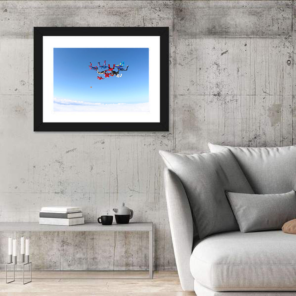 Skydiving Formation Over Clouds Wall Art in a room, landscape