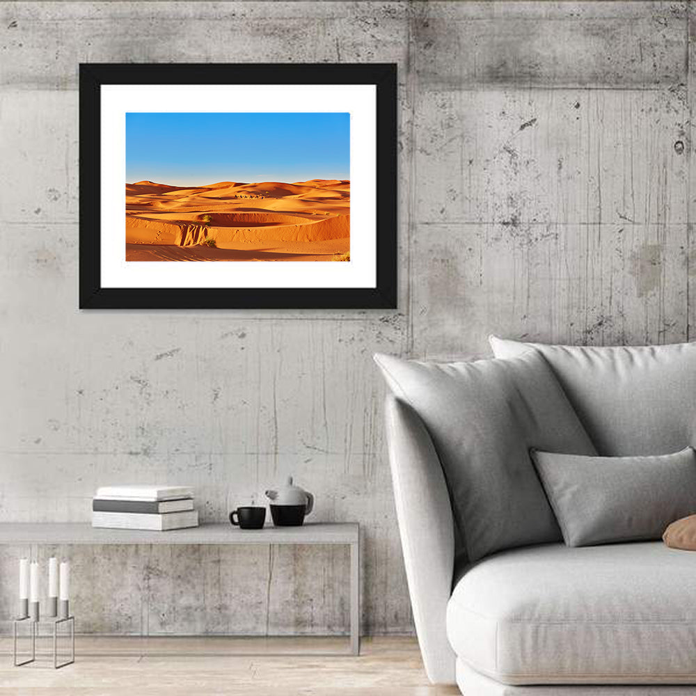 Sunlit Sahara Dunes with Camel Caravan Wall Art