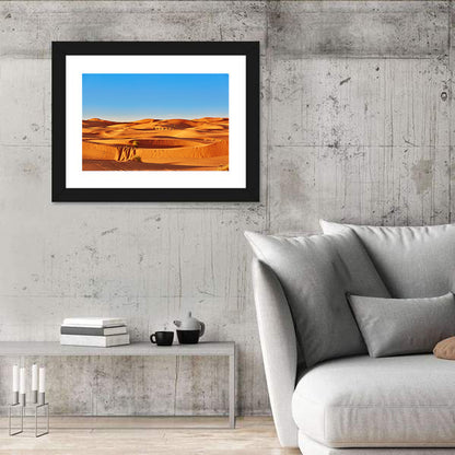 Sunlit Sahara Dunes with Camel Caravan Wall Art