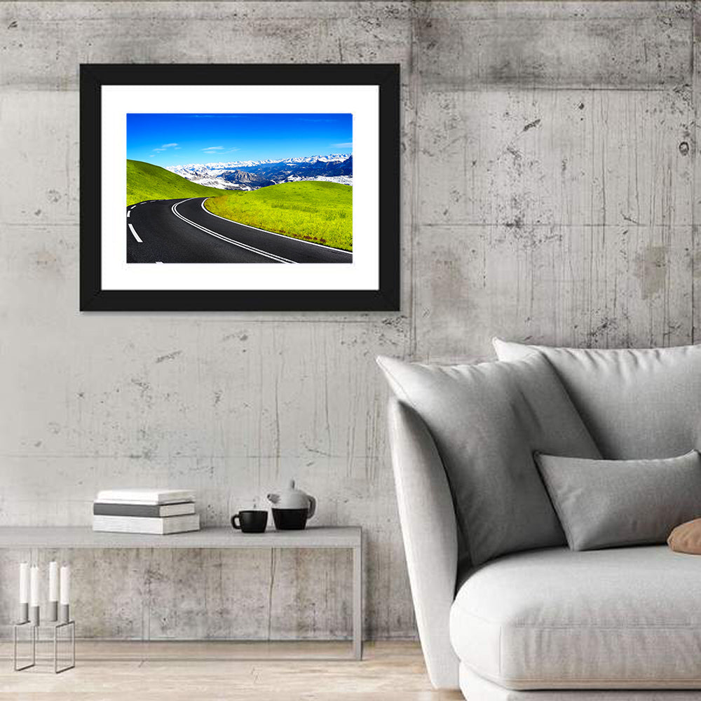Winding Road Through Snow-capped Mountains Wall Art in a room, landscape