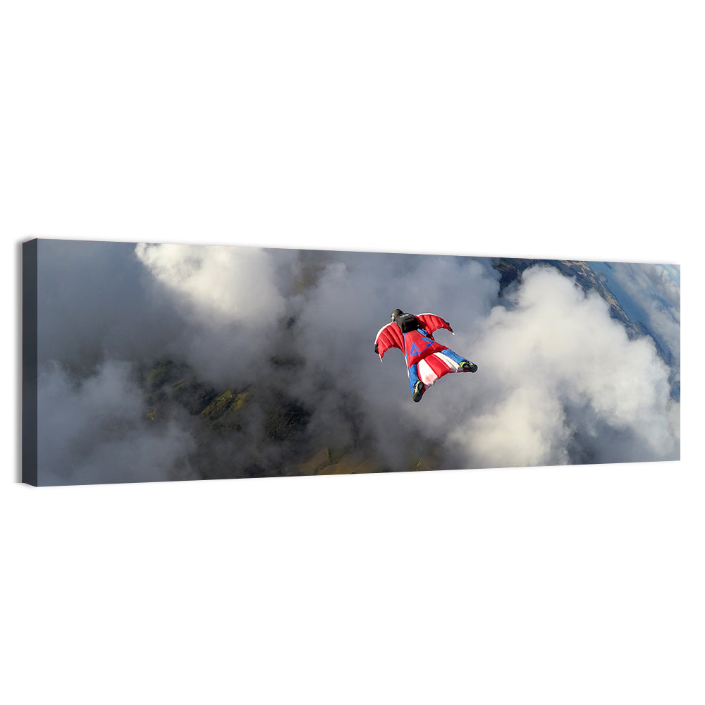 Red Wingsuit Skydiver Over Clouds Wall Art