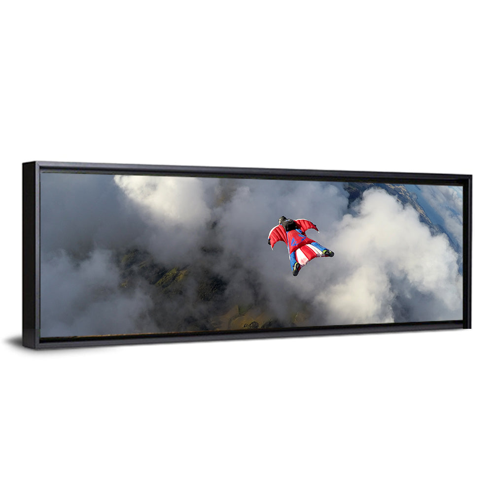 Red Wingsuit Skydiver Over Clouds Wall Art