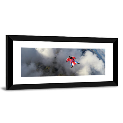 Red Wingsuit Skydiver Over Clouds Wall Art