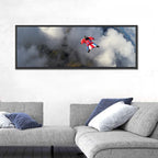 Red Wingsuit Skydiver Over Clouds Wall Art