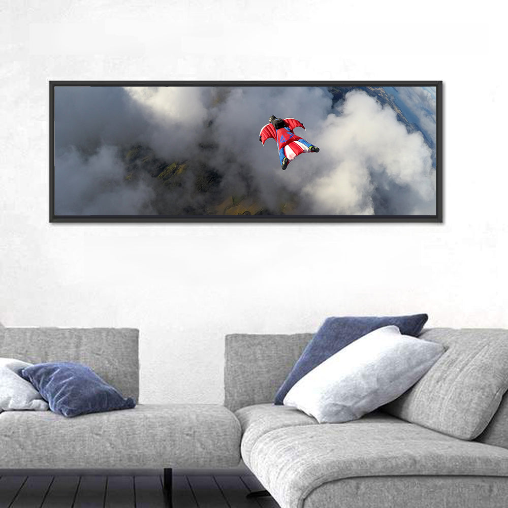 Red Wingsuit Skydiver Over Clouds Wall Art
