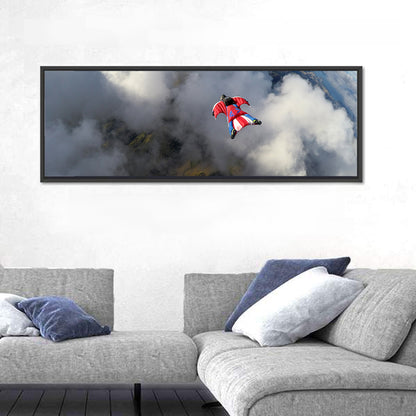 Red Wingsuit Skydiver Over Clouds Wall Art