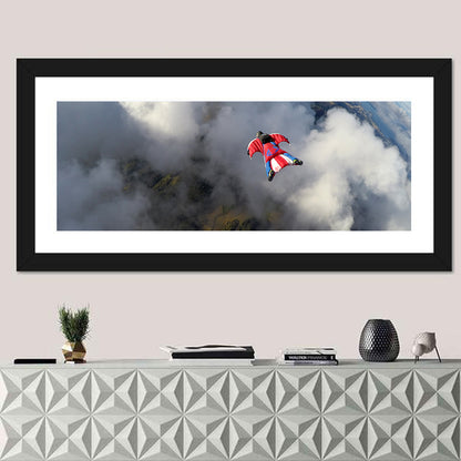Red Wingsuit Skydiver Over Clouds Wall Art