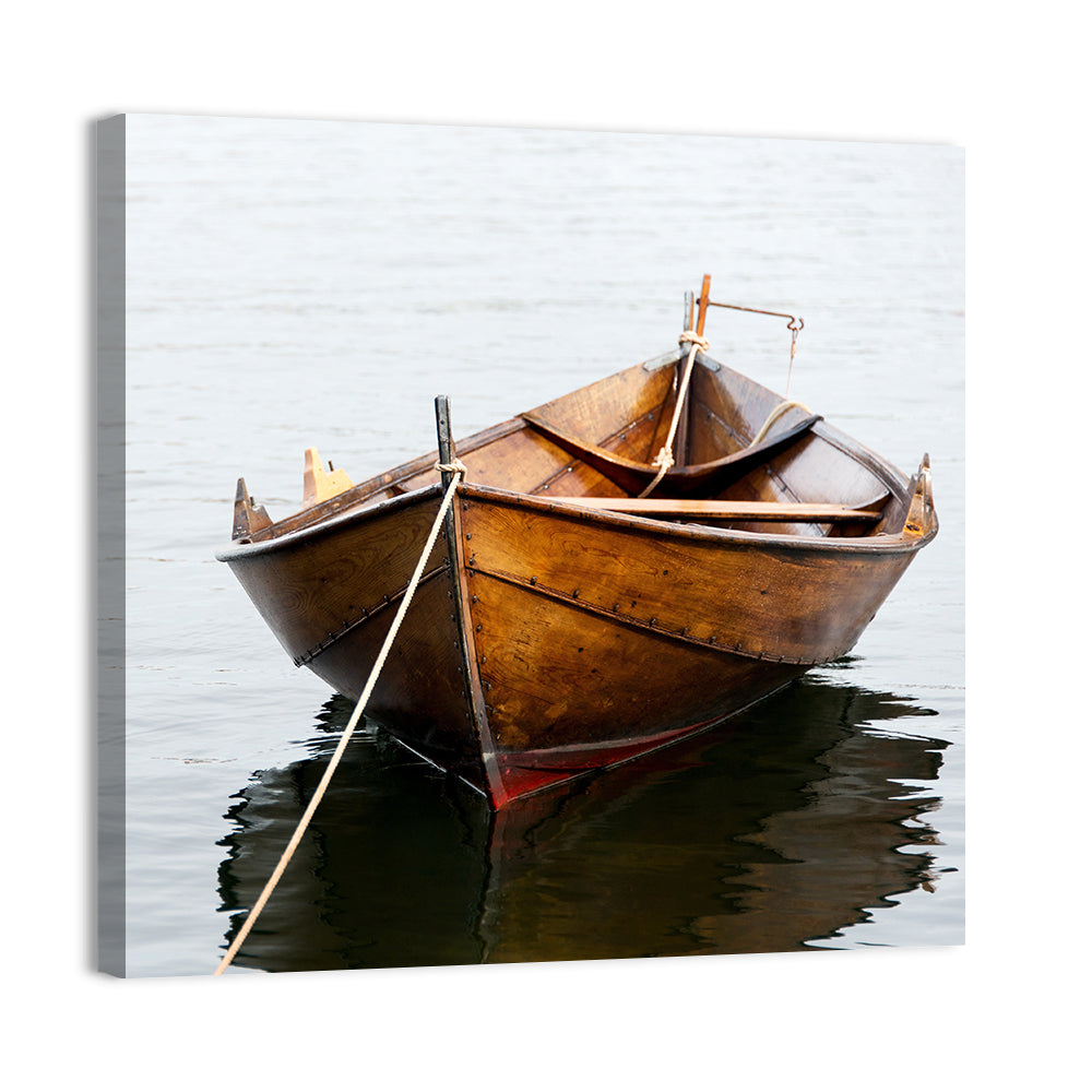 Tethered Wooden Rowboat on Calm Water Wall Art