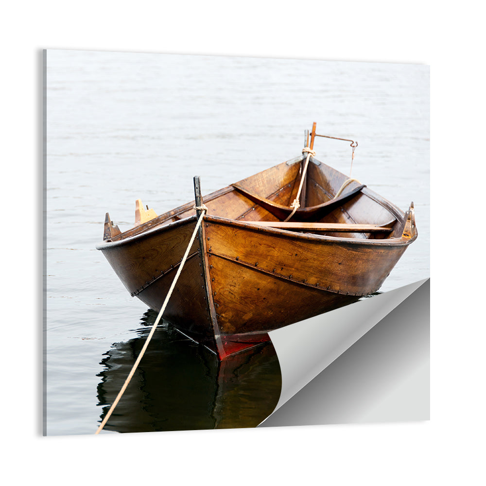 Tethered Wooden Rowboat on Calm Water Wall Art