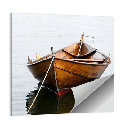 Tethered Wooden Rowboat on Calm Water Wall Art