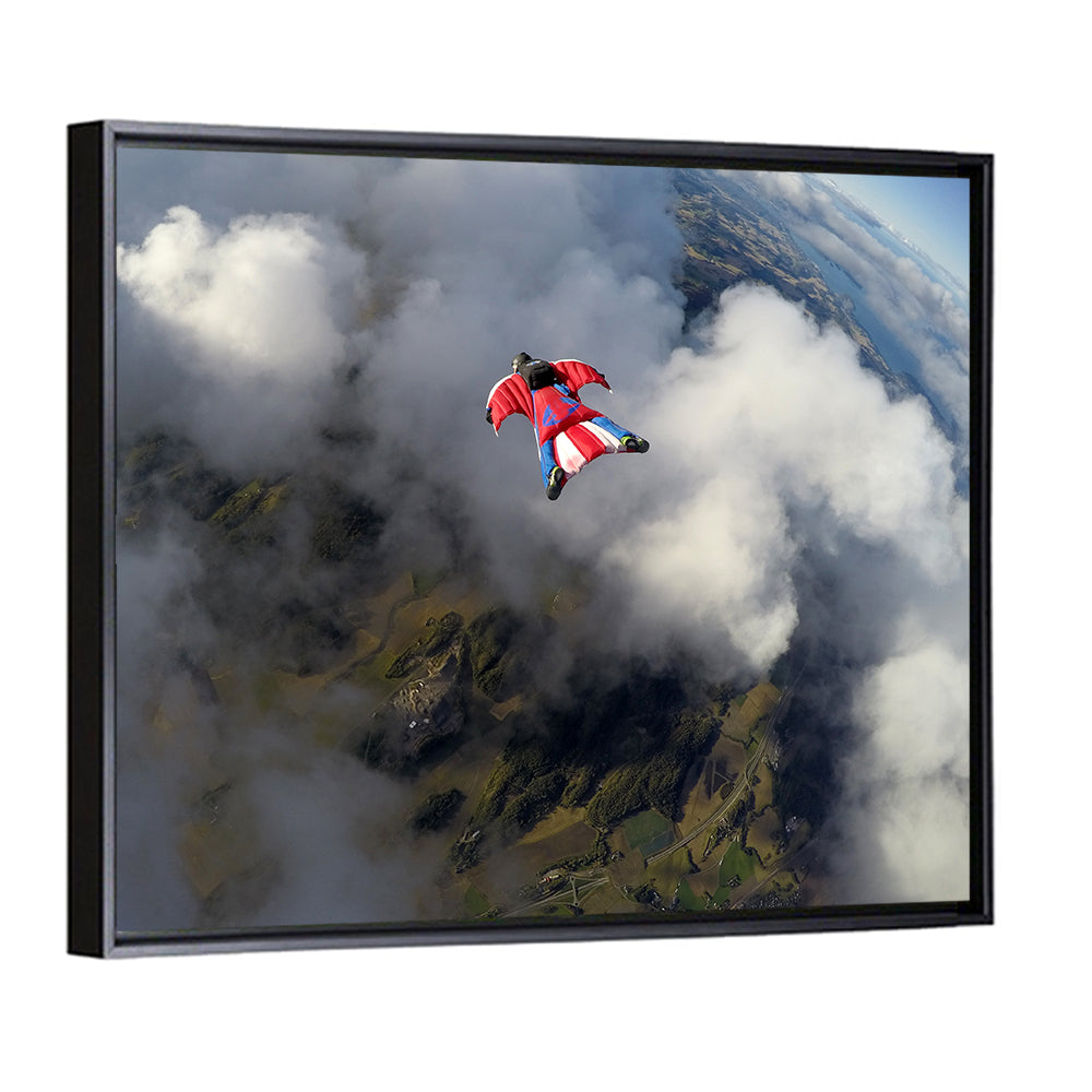 Red Wingsuit Skydiver Over Clouds Wall Art