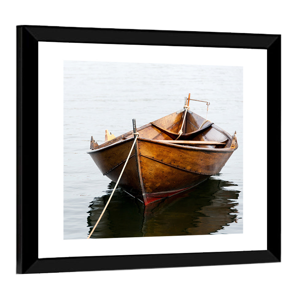 Tethered Wooden Rowboat on Calm Water Wall Art