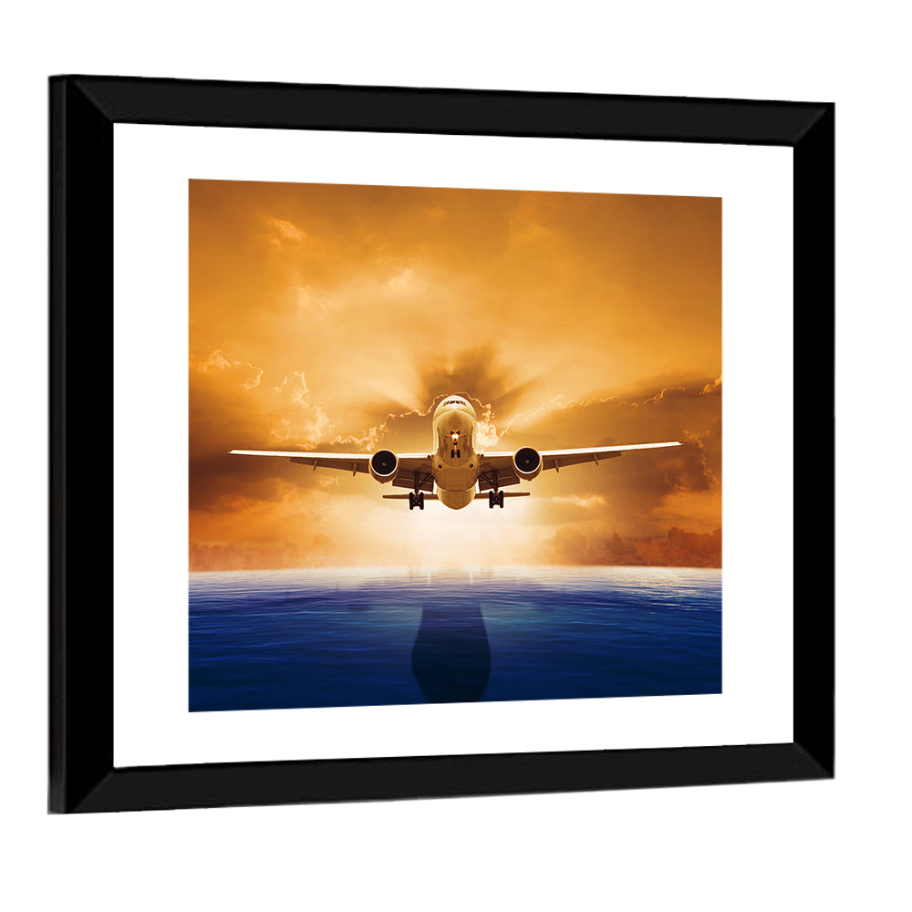 Landing Jet Over Ocean at Sunset Wall Art