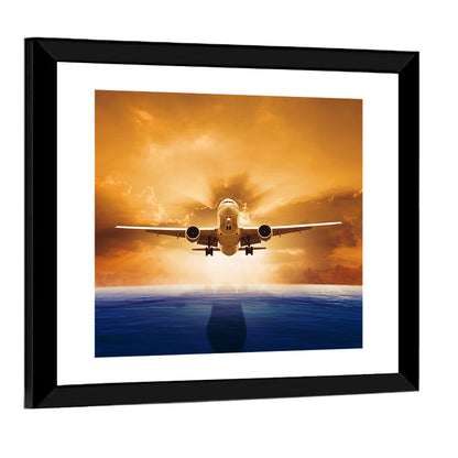 Landing Jet Over Ocean at Sunset Wall Art