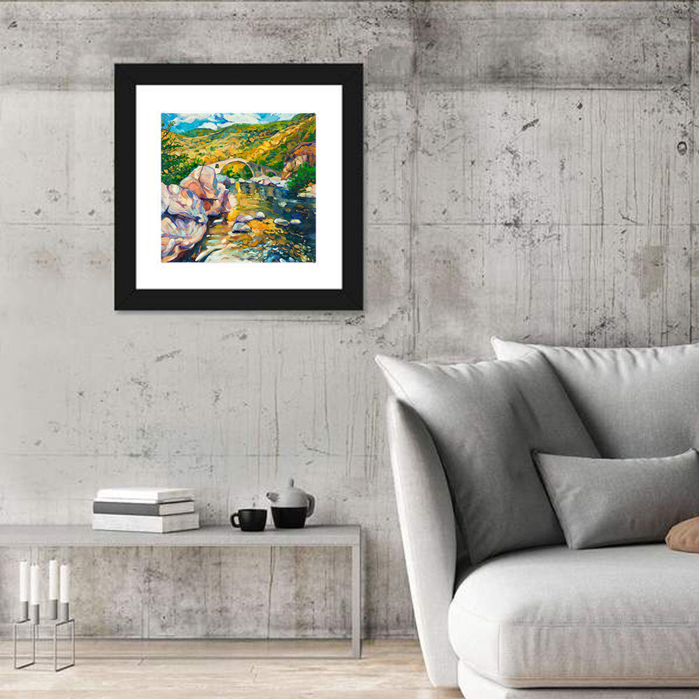Arched Stone Bridge in Mountain River Wall Art in a room, square