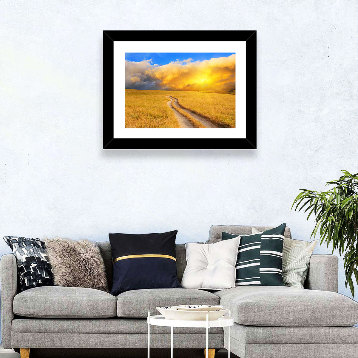 Sunlit Meadow Path with Dramatic Clouds Wall Art in a room, landscape