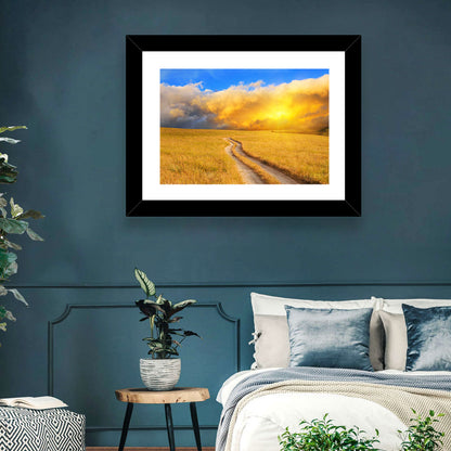 Sunlit Meadow Path with Dramatic Clouds Wall Art
