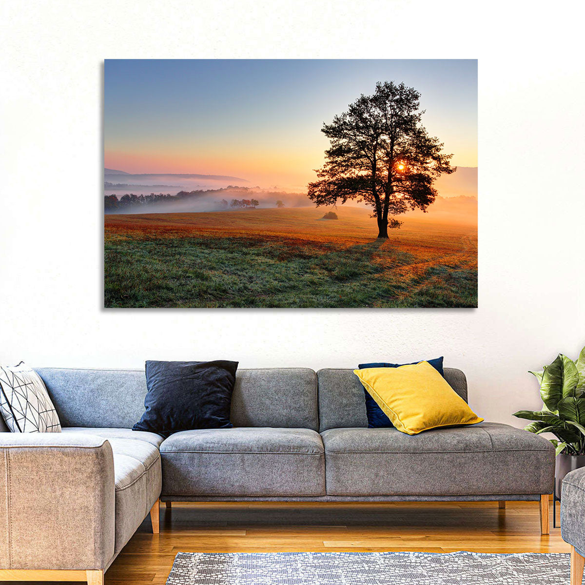 Misty Meadow Sunrise with Lone Tree Wall Art in a room, landscape