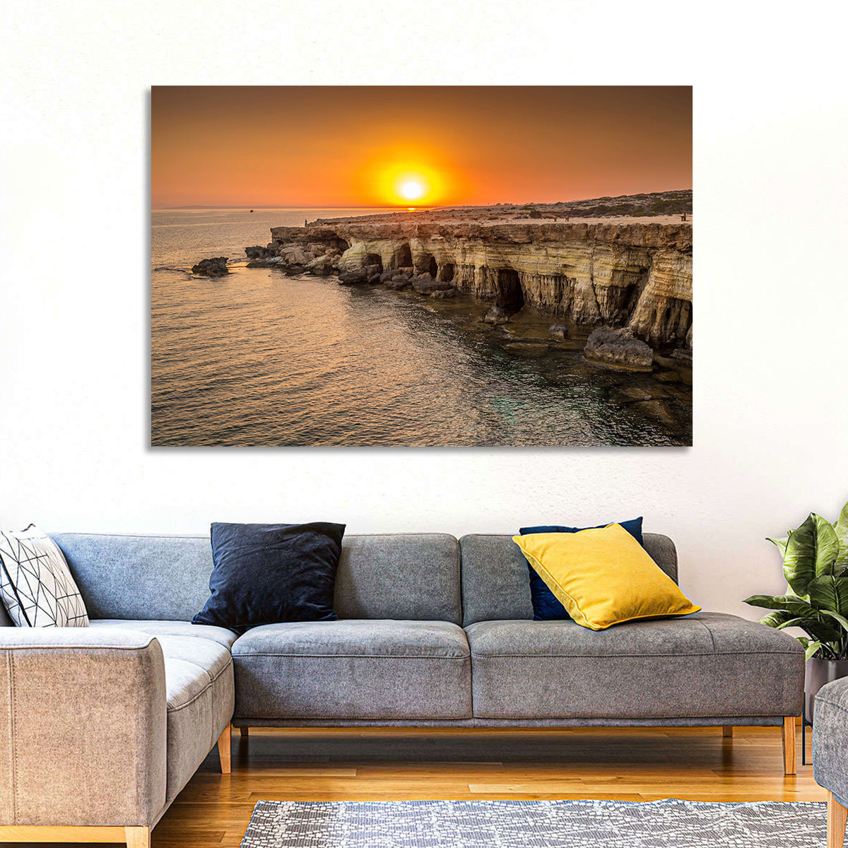 Sunset Over Sea Caves Wall Art in a room, landscape