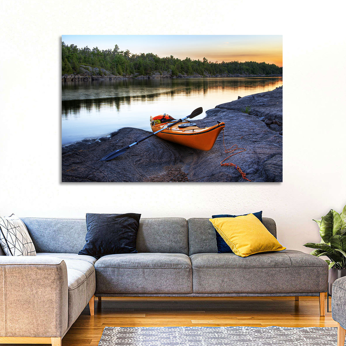 Orange Kayak on Rocky Shore Wall Art