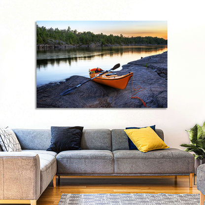 Orange Kayak on Rocky Shore Wall Art