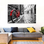 Red Bicycle on Rainy Cobblestone Street Wall Art