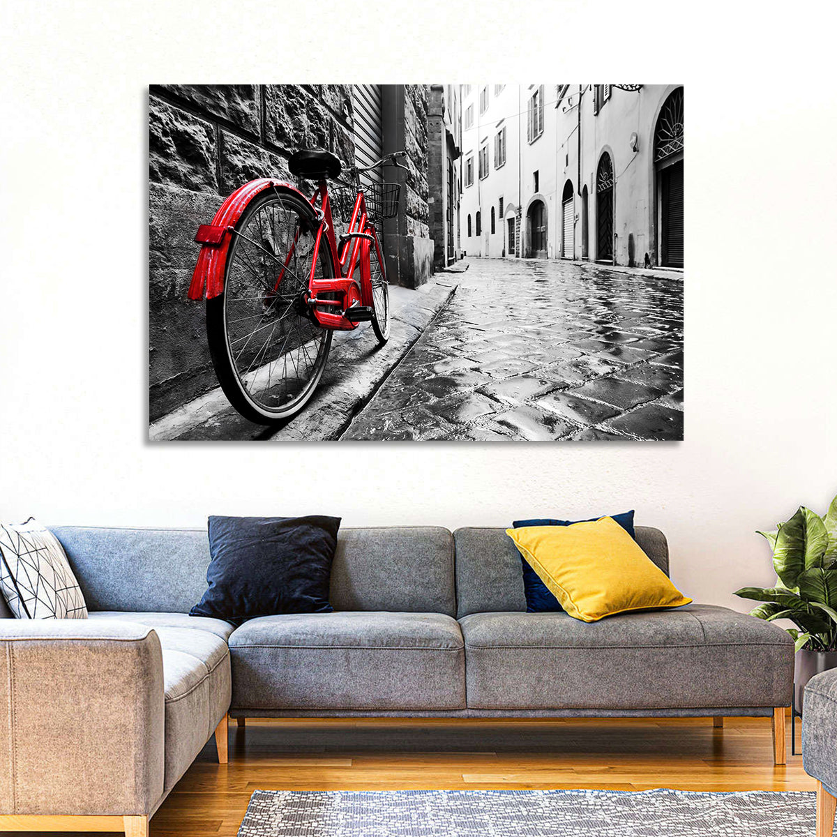 Red Bicycle on Rainy Cobblestone Street Wall Art