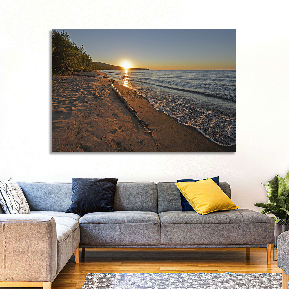 Lake Superior Driftwood Beach Sunset Wall Art in a room, landscape