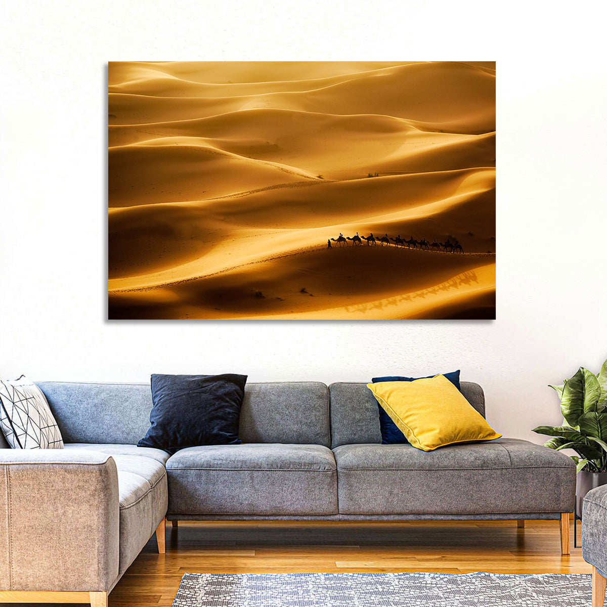 Golden Hour Camel Caravan Wall Art in a room, landscape