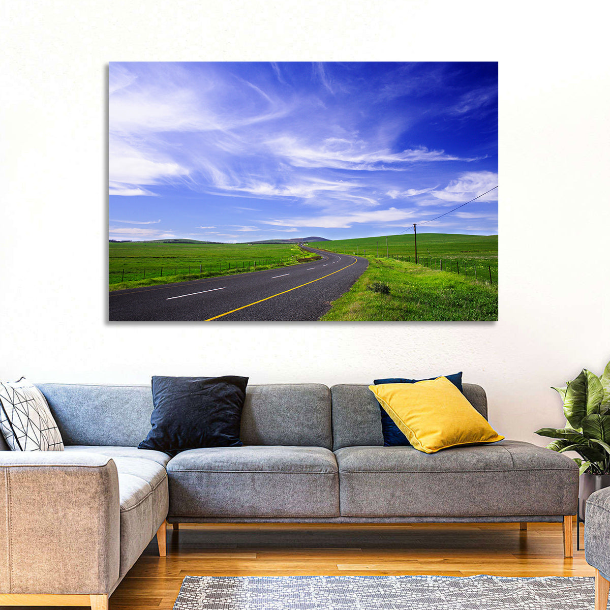 Winding Country Road in Green Fields Wall Art in a room, landscape