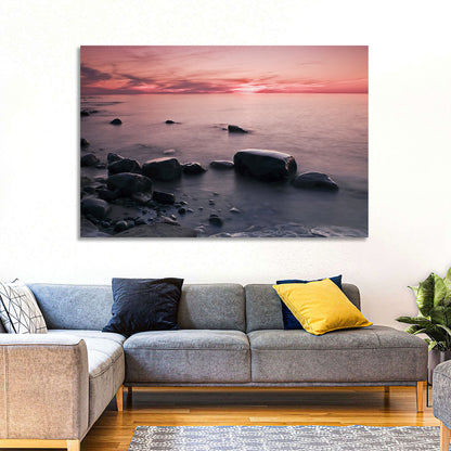 Pink Dusk Lakeshore with Silhouetted Rocks Wall Art