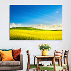 Rapeseed Field and Rolling Hills Under Blue Sky Wall Art