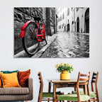 Red Bicycle on Rainy Cobblestone Street Wall Art