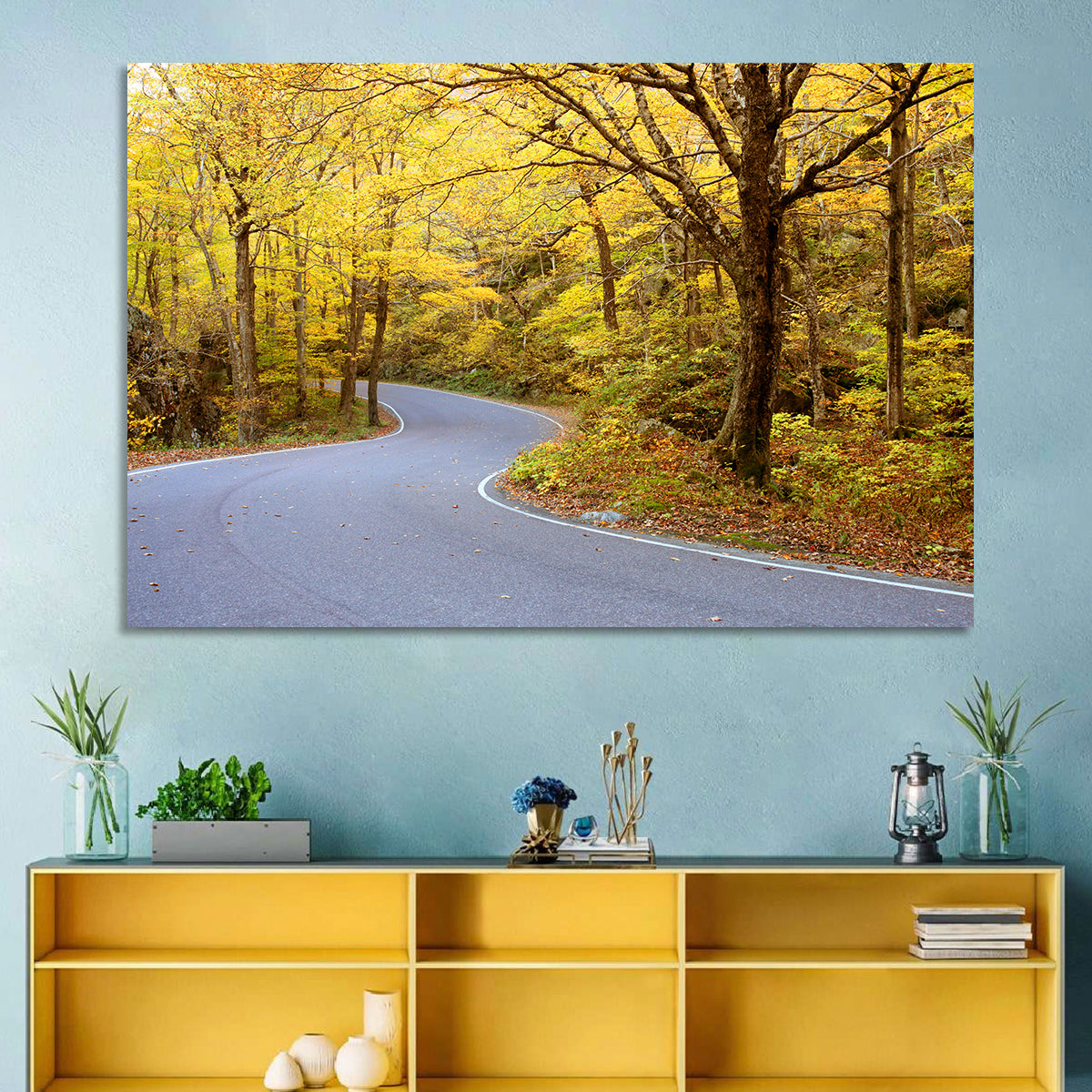 Winding Road Through Autumn Foliage Wall Art in a room, landscape