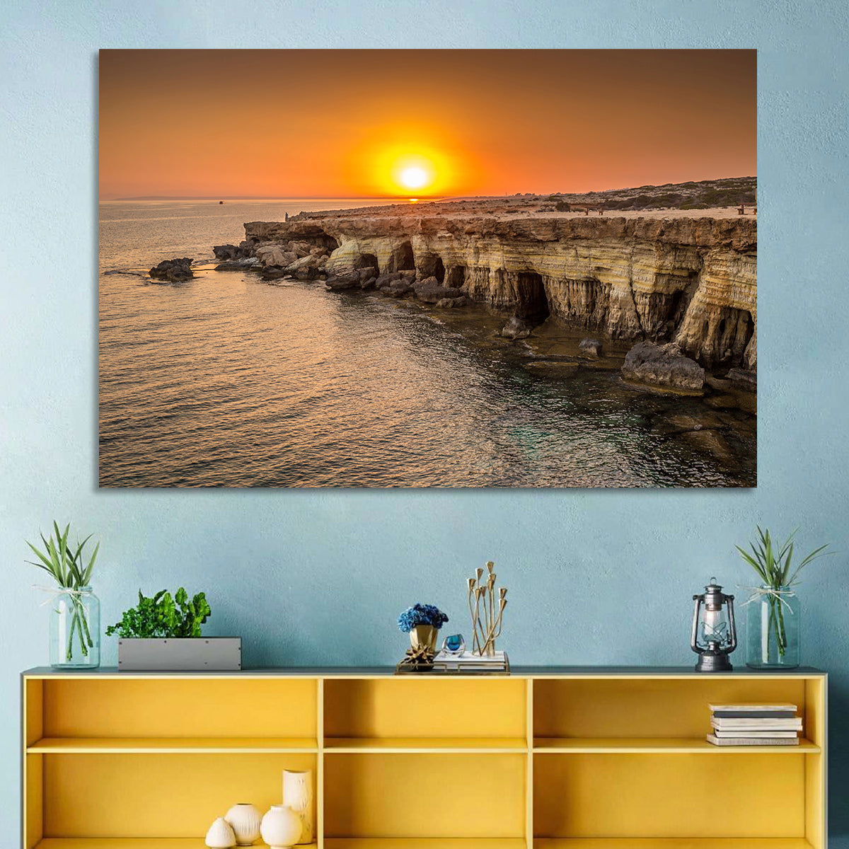 Sunset Over Sea Caves Wall Art in a room, landscape