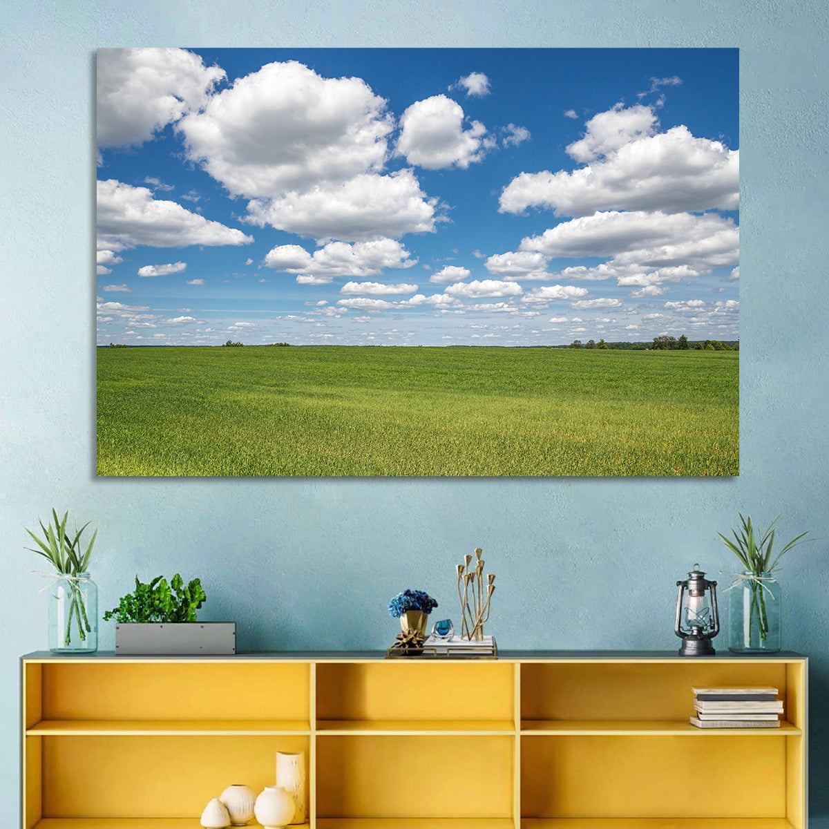 Cloud Filled Sky Over Meadow Wall Art in a room, landscape