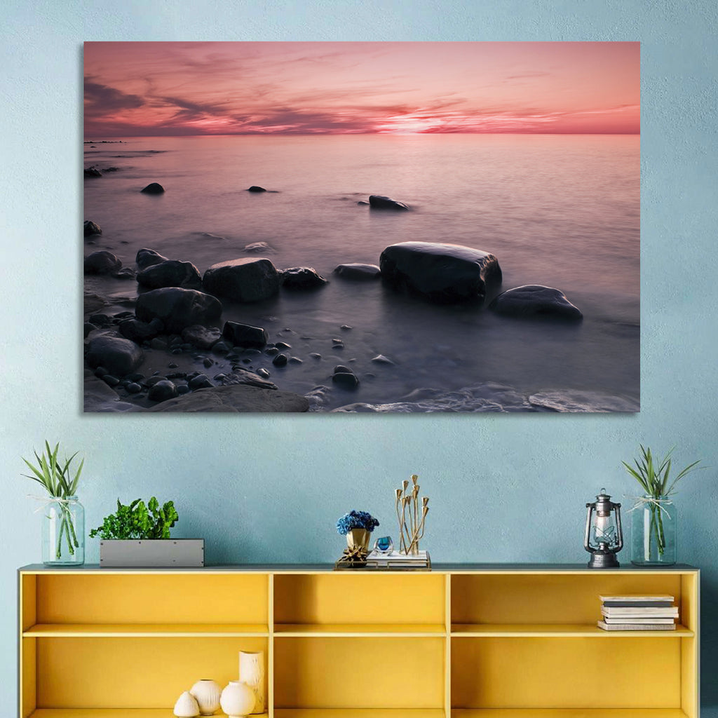 Pink Dusk Lakeshore with Silhouetted Rocks Wall Art