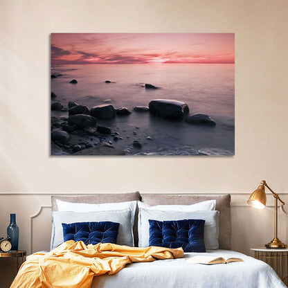 Pink Dusk Lakeshore with Silhouetted Rocks Wall Art