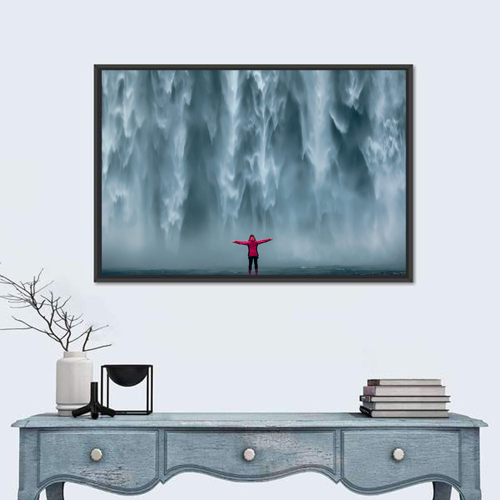 Skogafoss Waterfall with Figure in Pink Wall Art in a room, landscape