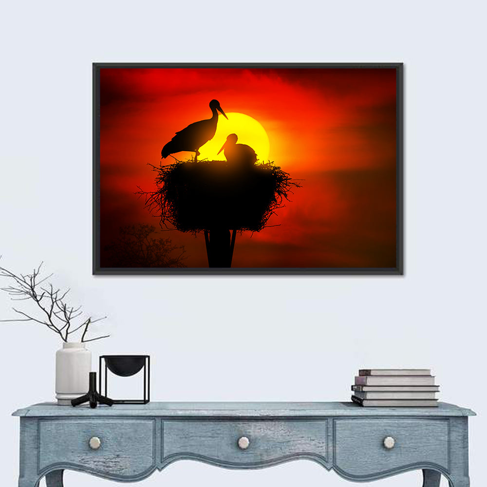 Storks in Nest at Sunset Wall Art in a room, landscape