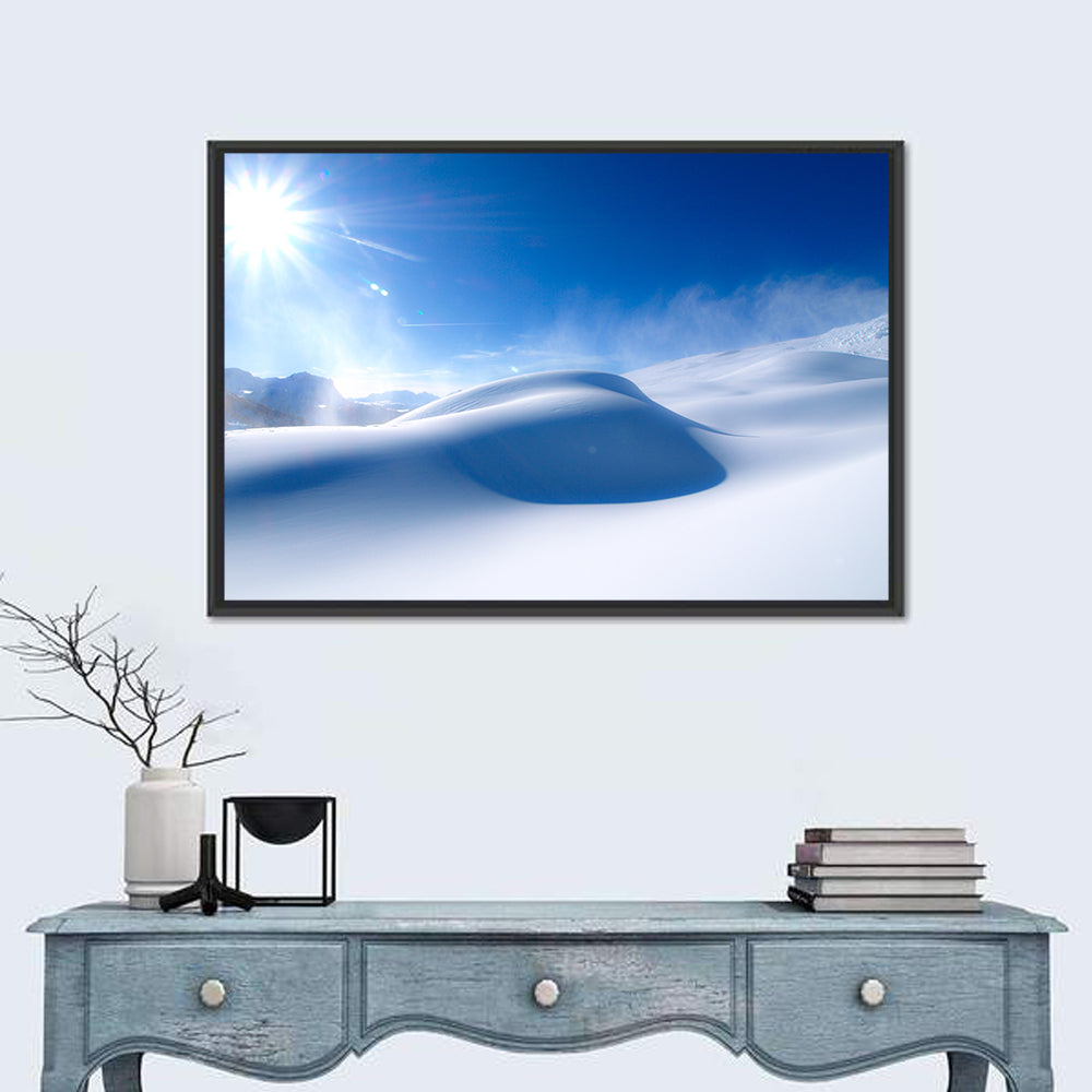 Sunlit Snow Dune Under Blue Sky Wall Art in a room, landscape