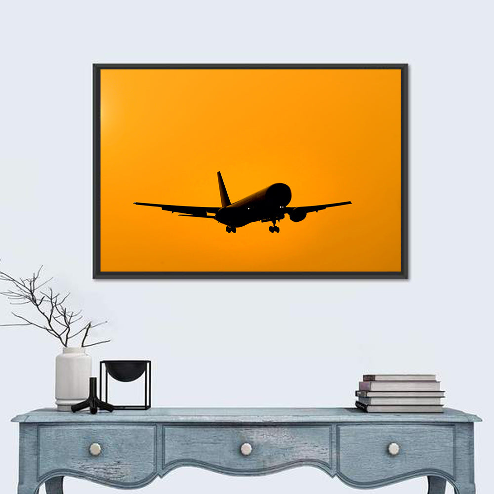Golden Hour Airliner Silhouette Wall Art in a room, landscape
