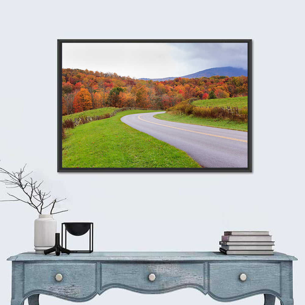 Curving Road Through Autumn Meadow Wall Art in a room, landscape