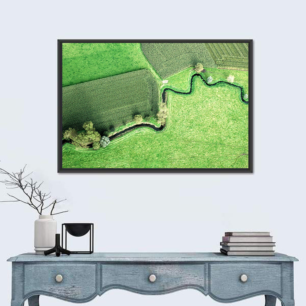 Meandering Stream Over Farmland Wall Art in a room, landscape