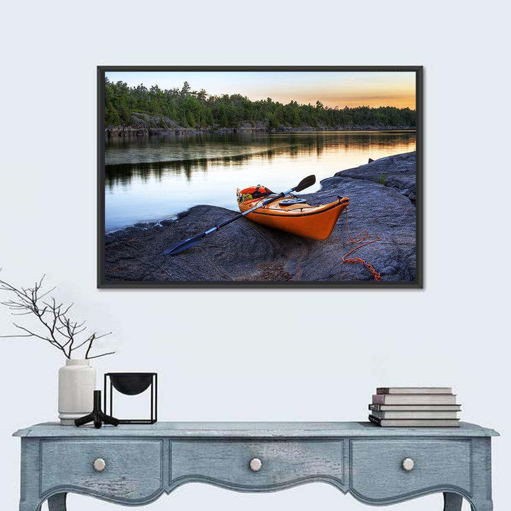 Orange Kayak on Rocky Shore Wall Art
