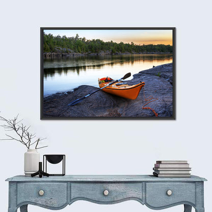Orange Kayak on Rocky Shore Wall Art